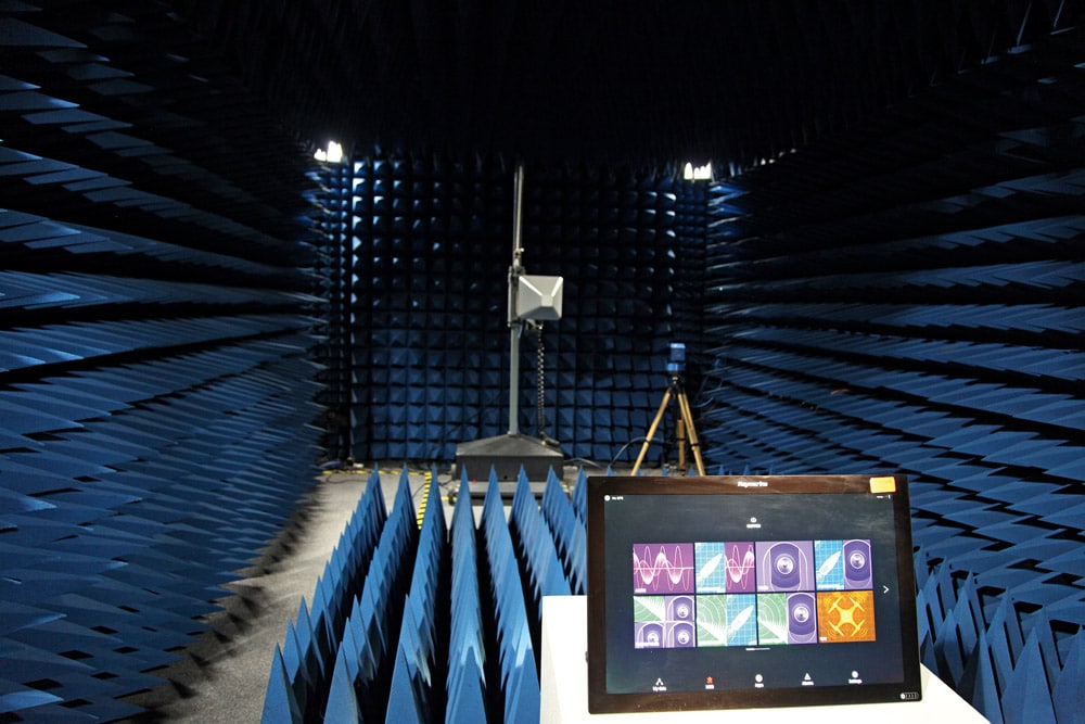 In a separate chamber, radiated emissions testing identifies the unintended release of electromagnetic energy.