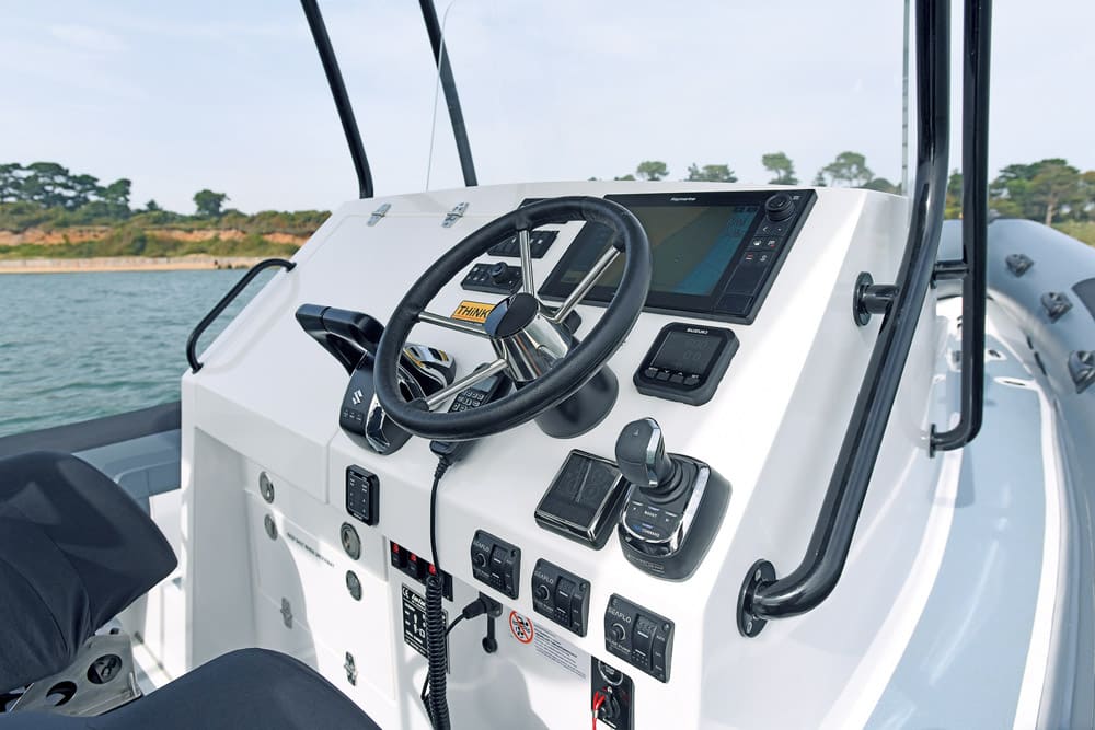 Island RIBs Notice joystick control right of wheel and cabin access to left.