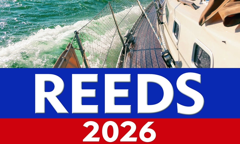 A yacht sailing through green waters, overlaid with bold REEDS 2026.