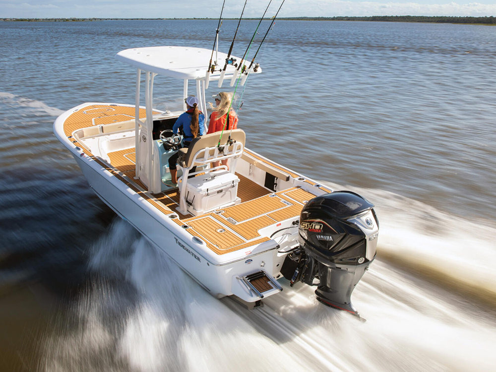 Fishing boat cruising at speed with Yamaha V MAX SHO outboard.