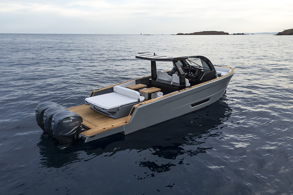 Maxim Yachts Max 44R walkaround at anchor, showing teak cockpit, sunpads, hardtop and triple Yamaha outboards on calm water