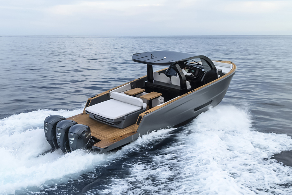 Maxim Yachts Max 44R walkaround daycruiser running offshore with triple Yamaha XTO outboards, teak deck and hardtop.