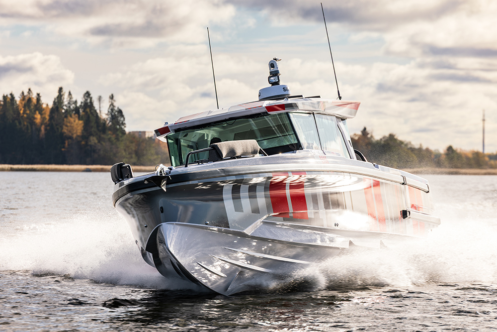 Axopar 38 underway in grey red and white livery